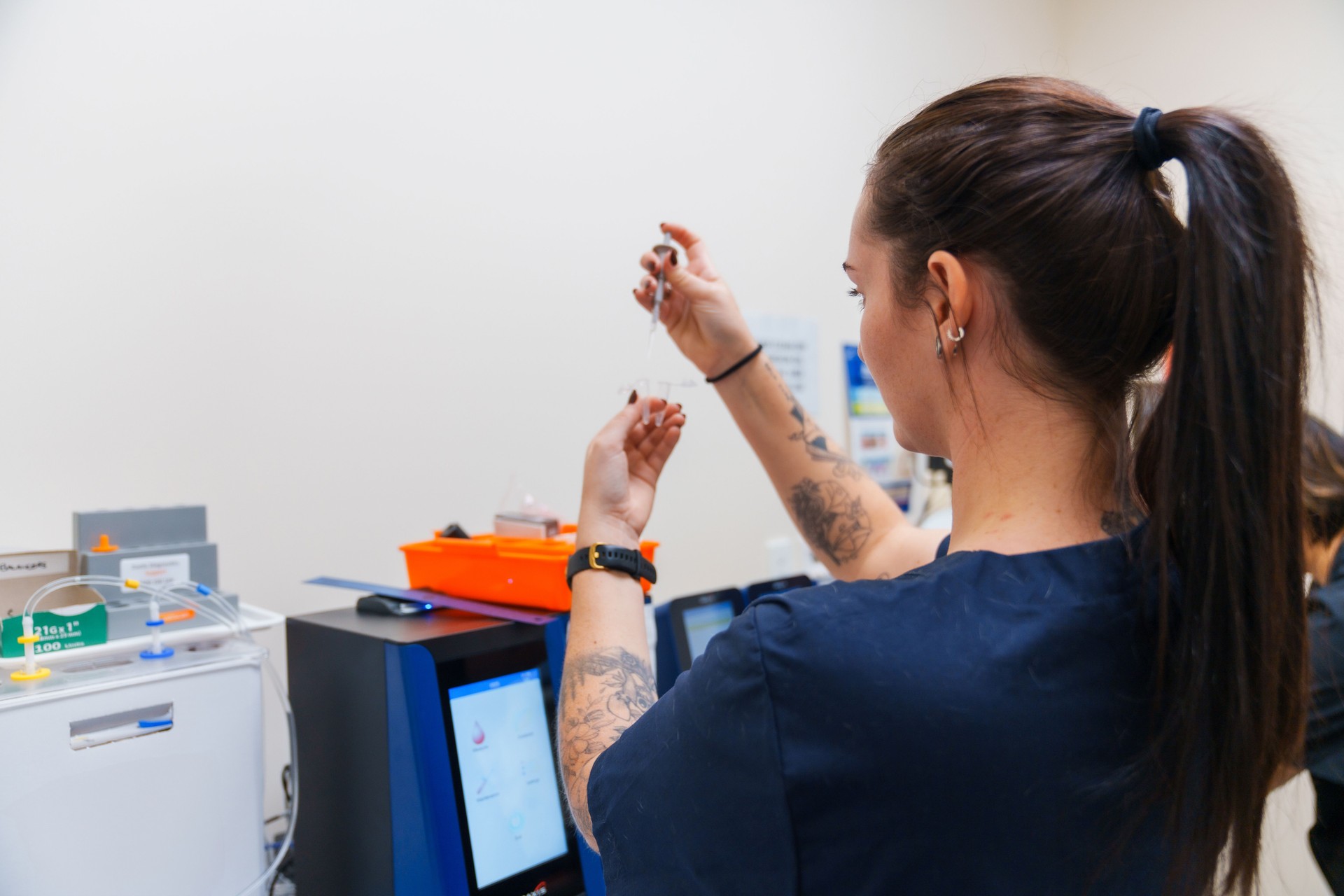 Female scientist working in laboratory.